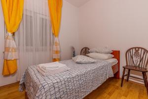 Postel nebo postele na pokoji v ubytování Apartman Dadi