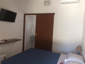Giường trong phòng chung tại Pousada Sr Marinheiro