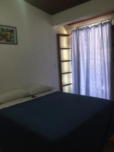 Giường trong phòng chung tại Pousada Sr Marinheiro