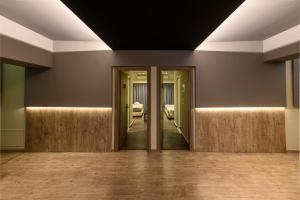 an empty room with doors and a hallway at Kleopatra Inn in Messini