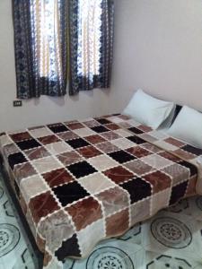 Postel nebo postele na pokoji v ubytování Pharaohs Hotel