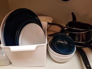 a white container sitting on a counter with a pot at Takaraboshi room 101 Sannomiya10min in Kobe