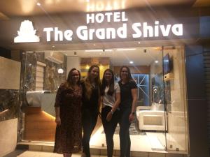 a group of women standing in front of a store at Hotel the grand shiva in Gondal