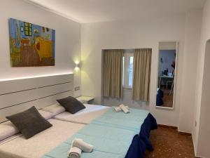 Posteľ alebo postele v izbe v ubytovaní Marqués de Guadiaro 1 Apartamentos