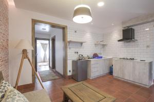 Η κουζίνα ή μικρή κουζίνα στο Uma Residency