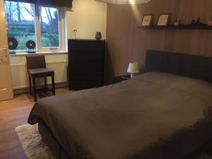 Postel nebo postele na pokoji v ubytování Rumah kita, bungalow met 2 slaapkamers in het mooie Drenthe