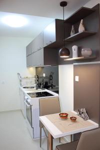 Kuchyň nebo kuchyňský kout v ubytování Bane Apartmani