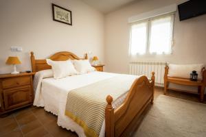 Apartamentos Pumarin客房内的一张或多张床位