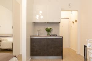 A kitchen or kitchenette at " CASA IDA " centro storico