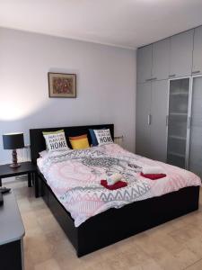a bedroom with a large bed in a room at City Center Lovely Studio Apartment in Belgrade