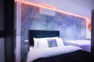 a bedroom with a bed and a sink at Langery Residence Central Apartments in Odesa