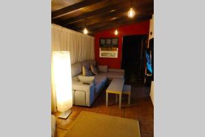 a living room with a couch and a table at Finca Lomo Grande in Hermigua