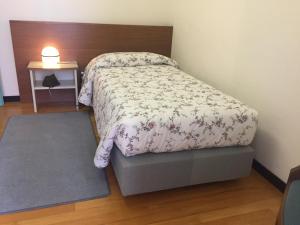 Postel nebo postele na pokoji v ubytování Casaalbergo La Rocca