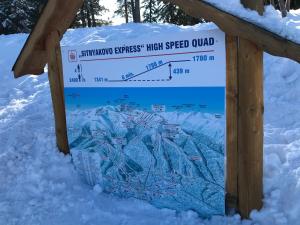 a sign in the snow with snow on it at Studio in Hotel Flora Borovets in Borovets