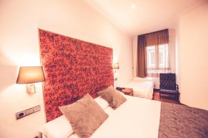 Ένα ή περισσότερα κρεβάτια σε δωμάτιο στο Hostal Sol Los Angeles