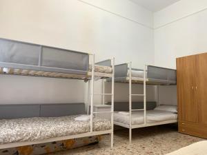 a room with two bunk beds and a cabinet at Dream Destination Rome in Rome