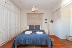 מיטה או מיטות בחדר ב-La Casita - centro histórico y playa