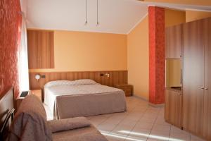 a hotel room with two beds and a kitchen at La Lanterna in Silvi Marina
