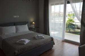 Posteľ alebo postele v izbe v ubytovaní B&B La Rosa dei Venti