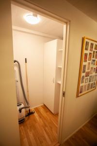 an open door to a room with a treadmill at Tórshavn Apartment - In The Center in Tórshavn