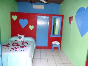A bed or beds in a room at Hotel Corazon Sayulita