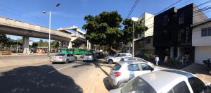 a group of cars parked on a city street at HOTEL CASA MAYOR LA 70 in Medellín