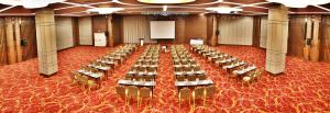 a large room with rows of tables and chairs at Holiday Inn Ankara - Cukurambar, an IHG Hotel in Ankara