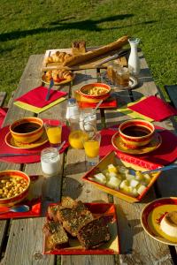 a picnic table with plates of food on it at El Casal in Prats-de-Mollo-la-Preste