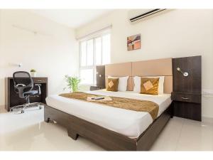 Giường trong phòng chung tại Olive Service Apartments Hitech City