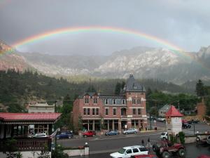 
a large building with a sky background at Beaumont Hotel and Spa - Adults Only in Ouray
