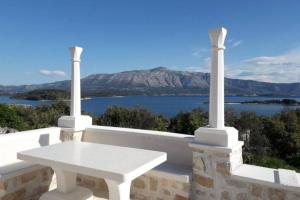 a white bench sitting on top of a building at House Zemina in Lumbarda +17 photos