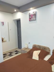 Postel nebo postele na pokoji v ubytování Fiesta Apartman