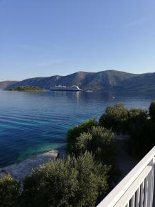 a view of a large body of water with mountains at I&J Relaxing Beach Apartments in Račišće