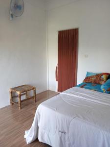 Кровать или кровати в номере Ramdan Homestay