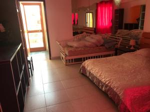 Ένα ή περισσότερα κρεβάτια σε δωμάτιο στο Villa belvedere mini appartamento