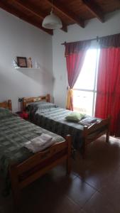 Ένα ή περισσότερα κρεβάτια σε δωμάτιο στο Departamento Ananda