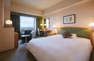 Postel nebo postele na pokoji v ubytování Royal Pines Hotel Urawa
