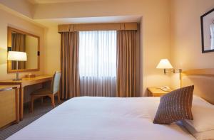 Postel nebo postele na pokoji v ubytování Royal Pines Hotel Urawa