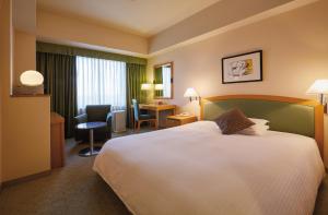 Postel nebo postele na pokoji v ubytování Royal Pines Hotel Urawa