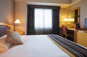 Postel nebo postele na pokoji v ubytování Royal Pines Hotel Urawa