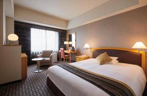 Postel nebo postele na pokoji v ubytování Royal Pines Hotel Urawa