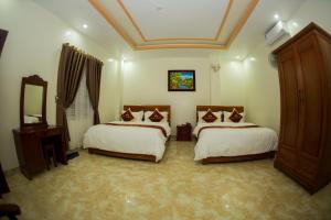 Een bed of bedden in een kamer bij Mai Anh Hotel