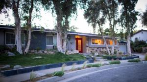 a house with a red door and some trees at Artistic Resort Like Home with Pool in Fullerton