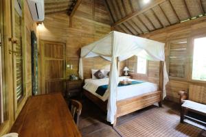Ένα ή περισσότερα κρεβάτια σε δωμάτιο στο Song Broek Bali