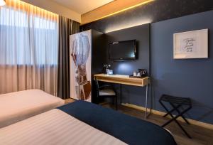 Posteľ alebo postele v izbe v ubytovaní Holiday Inn Bologna - Fiera by IHG + 37 fotografií