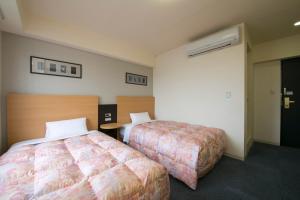 Hotel Econo Taki 객실 침대