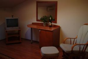 Televízia a/alebo spoločenská miestnosť v ubytovaní Apartments Villa Novak