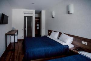 Кровать или кровати в номере Hotel La Confiture