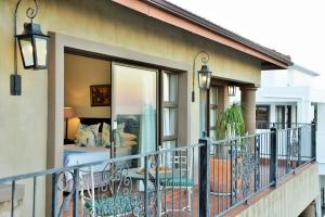 a balcony with a view of a bedroom at The Vineyard on Ballito in Ballito