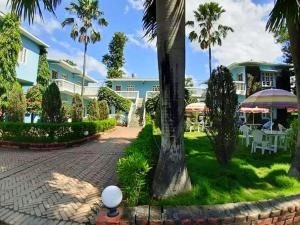 a cobblestone walkway in front of a resort at Hotel Megha-Traveller's Village in Nepālganj